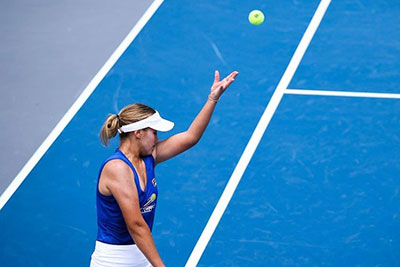 Sophia Kennin playing in a tennis match